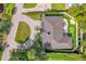 Bird's-eye view of home with circular driveway and putting green at 238 E Lakeshore Dr, Clermont, FL 34711