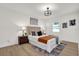 Bright bedroom with a neutral color scheme and hardwood floors at 238 E Lakeshore Dr, Clermont, FL 34711