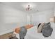 Bright bedroom with cozy bedding and built-in closet at 238 E Lakeshore Dr, Clermont, FL 34711
