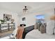 Main bedroom with plush bedding and plenty of natural light at 238 E Lakeshore Dr, Clermont, FL 34711