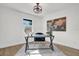 Home office featuring a desk, chair, and world map art at 238 E Lakeshore Dr, Clermont, FL 34711