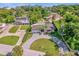 Spacious home with circular driveway and lush landscaping at 238 E Lakeshore Dr, Clermont, FL 34711
