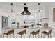 Modern kitchen with white shaker cabinets, granite counters and island at 238 E Lakeshore Dr, Clermont, FL 34711