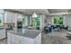 Modern kitchen with large island, stainless steel appliances, and open floor plan at 3087 Norcott Dr, Davenport, FL 33837