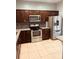 Modern kitchen with stainless steel appliances and granite countertops at 1347 Heather Lake Dr, Orlando, FL 32824