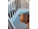 Modern staircase with white railings and gray walls at 1347 Heather Lake Dr, Orlando, FL 32824