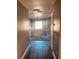 Upstairs hallway with wood-look flooring and a window at 1347 Heather Lake Dr, Orlando, FL 32824