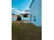 Backyard of home with green grass and white fence at 1347 Heather Lake Dr, Orlando, FL 32824