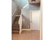 Modern staircase with wood-look flooring and white railing at 1347 Heather Lake Dr, Orlando, FL 32824