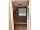 Small room with wood-look floors and a window with blinds at 1347 Heather Lake Dr, Orlando, FL 32824
