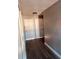 Bright hallway with wood-look flooring and neutral walls at 1347 Heather Lake Dr, Orlando, FL 32824