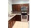 Modern kitchen with stainless steel appliances and granite countertops at 1347 Heather Lake Dr, Orlando, FL 32824