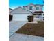 Two-story house with a double garage and well-manicured landscaping at 1347 Heather Lake Dr, Orlando, FL 32824