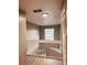 Upstairs hallway with white railing and large window at 1347 Heather Lake Dr, Orlando, FL 32824