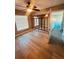 Spacious bedroom with mirrored wall and wood-look floors at 1347 Heather Lake Dr, Orlando, FL 32824