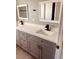 Modern bathroom with gray cabinets and white countertops at 1347 Heather Lake Dr, Orlando, FL 32824