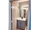 Modern bathroom with gray vanity and white countertop at 1347 Heather Lake Dr, Orlando, FL 32824