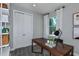 Home office features built-in shelving and a workspace with natural light at 3086 Norcott Dr, Davenport, FL 33837