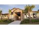 Community clubhouse with stone facade and palm trees at 15871 Tollington Aly, Winter Garden, FL 34787
