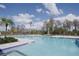 Inviting community pool with surrounding landscaping at 15871 Tollington Aly, Winter Garden, FL 34787