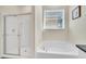 Updated bathroom with a shower and tub, perfect for relaxing at 7876 Oak Reflection Loop, Davenport, FL 33837