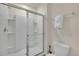 Simple bathroom with a shower/tub combo and a toilet at 7876 Oak Reflection Loop, Davenport, FL 33837
