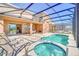 Private pool and spa with lounge chairs and patio at 7876 Oak Reflection Loop, Davenport, FL 33837