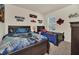 ' bedroom with twin beds, themed decor, and ample closet space at 7876 Oak Reflection Loop, Davenport, FL 33837