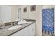 Bathroom with a double vanity, granite countertops, and a shower at 7876 Oak Reflection Loop, Davenport, FL 33837
