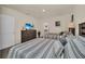 Guest bedroom with two twin beds and access to a shared bathroom at 7876 Oak Reflection Loop, Davenport, FL 33837