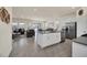 Open kitchen with island, granite countertops, and stainless steel appliances at 7876 Oak Reflection Loop, Davenport, FL 33837