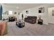 Bright bonus room featuring a cozy seating area and a small dining table at 7876 Oak Reflection Loop, Davenport, FL 33837
