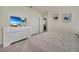 Main bedroom featuring a large bed, dresser, and access to a private bathroom at 7876 Oak Reflection Loop, Davenport, FL 33837