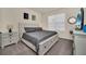 Bright bedroom featuring a king-size bed and light wood furniture at 7876 Oak Reflection Loop, Davenport, FL 33837