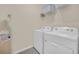 Laundry room with washer, dryer, and additional shelving at 7876 Oak Reflection Loop, Davenport, FL 33837