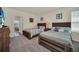 Guest bedroom with two twin beds and a view into another bedroom at 7876 Oak Reflection Loop, Davenport, FL 33837