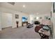 Spacious bonus room with TV, comfortable seating, and a small dining area at 7876 Oak Reflection Loop, Davenport, FL 33837
