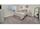 Bright bedroom with a comfortable bed and plenty of storage space at 7876 Oak Reflection Loop, Davenport, FL 33837