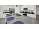 Kitchen island with granite countertop and four barstools at 7876 Oak Reflection Loop, Davenport, FL 33837