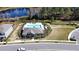 Aerial view of community with lake, pool, and homes at 15859 Tollington Aly, Winter Garden, FL 34787