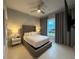 Comfortable bedroom with a king-size bed and plenty of natural light at 7740 Sandy Ridge Dr # 135, Kissimmee, FL 34747