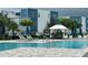 Relaxing pool area with a covered seating area at 7740 Sandy Ridge Dr # 135, Kissimmee, FL 34747