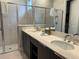Double vanity with modern sinks and a shower at 7740 Sandy Ridge Dr # 135, Kissimmee, FL 34747