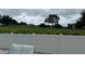 Landscaped backyard with green space and white fence at 7740 Sandy Ridge Dr # 135, Kissimmee, FL 34747