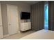 Bedroom with a dresser and TV at 7740 Sandy Ridge Dr # 135, Kissimmee, FL 34747