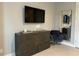 Well-lit bedroom with dresser, chair, and large TV at 7740 Sandy Ridge Dr # 135, Kissimmee, FL 34747