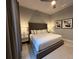 Spacious bedroom with king-size bed, nightstands, and ceiling fan at 7740 Sandy Ridge Dr # 135, Kissimmee, FL 34747