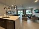 Modern kitchen with an island, stainless steel appliances, and an open layout at 7740 Sandy Ridge Dr # 135, Kissimmee, FL 34747