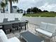 Private patio with seating area and view of green space at 7740 Sandy Ridge Dr # 135, Kissimmee, FL 34747