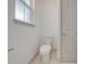 Small bathroom with toilet and single window at 4266 La Salle Ave, Saint Cloud, FL 34772